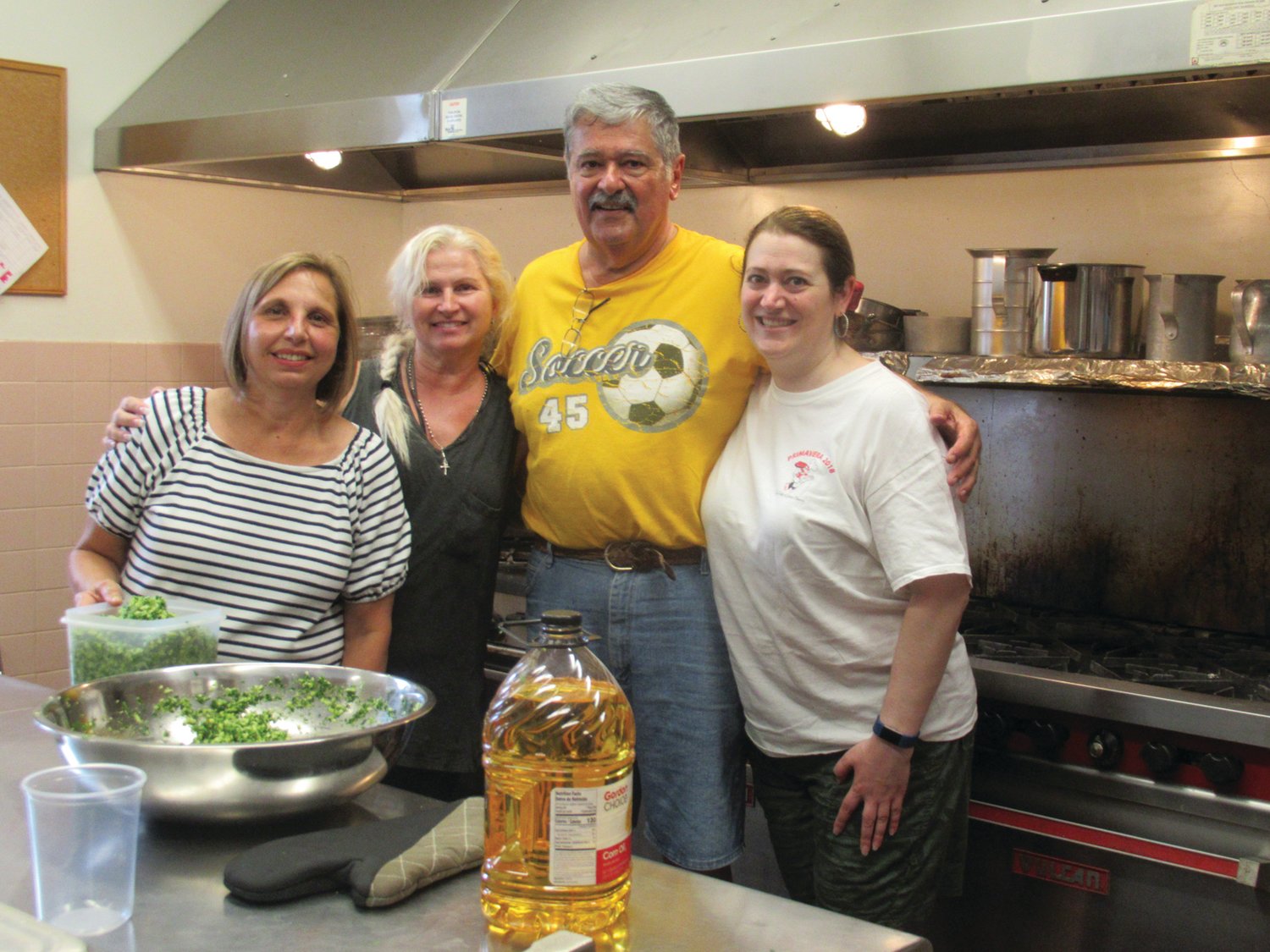 VALUABLE VOLS: Among the countless volunteers who have worked planning and gearing up for Our Lady of Grace’s 101st Feast and Festival are, from left: Rebecca Baggesen, Darleen Rampini, All Colannino and Laura Colannino.